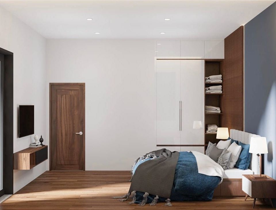 Hệ tủ âm tường đồng màu với tường và trần vừa giúp không gian thêm rộng mở, vừa tạo sự liền mạch cho tổng thể căn phòng