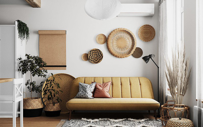 Những vật dụng trang trí đậm tính hoài cổ vẫn hài hòa với không gian phòng khách hiện đại. Gam màu nâu vàng của ghế sofa rất phù hợp với các món đồ mây tre đan xinh xắn này.