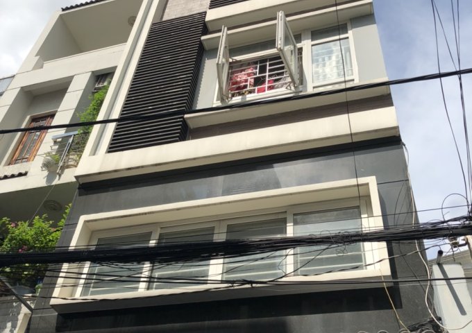 Bán gấp nhà 2 mặt tiền Nguyễn Trọng Tuyển 5 x 18 nhà 4 lầu thang máy .